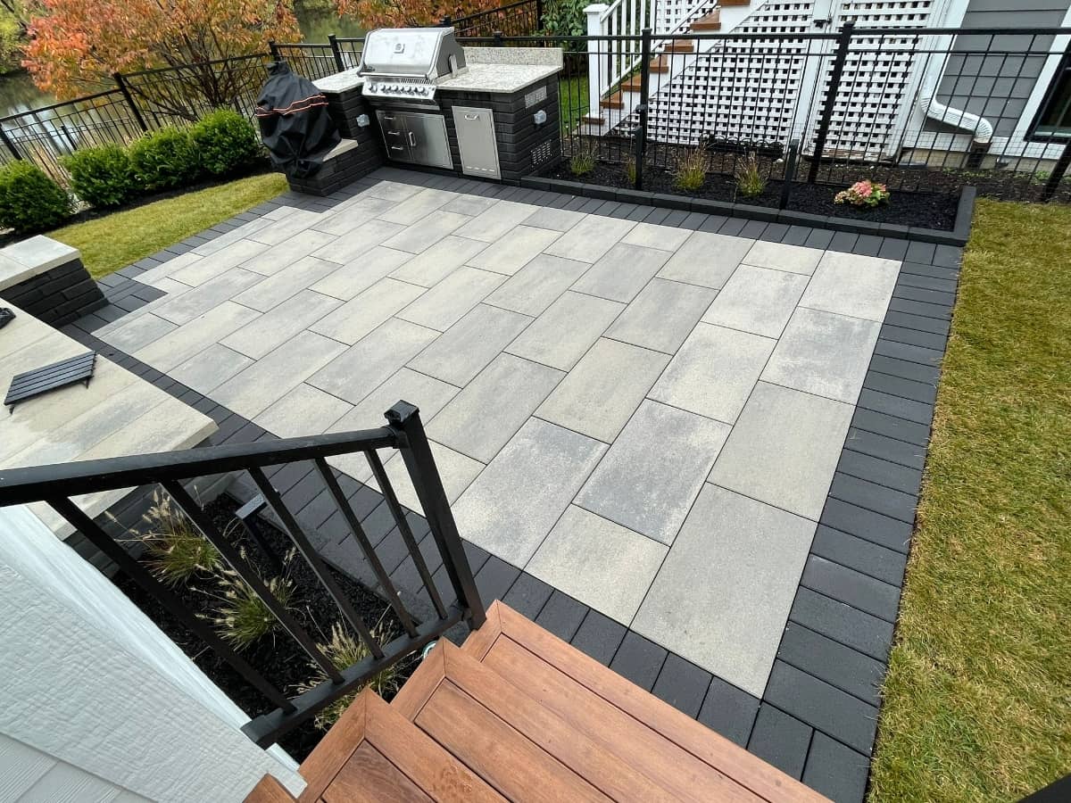 gray paved patio with black tiles