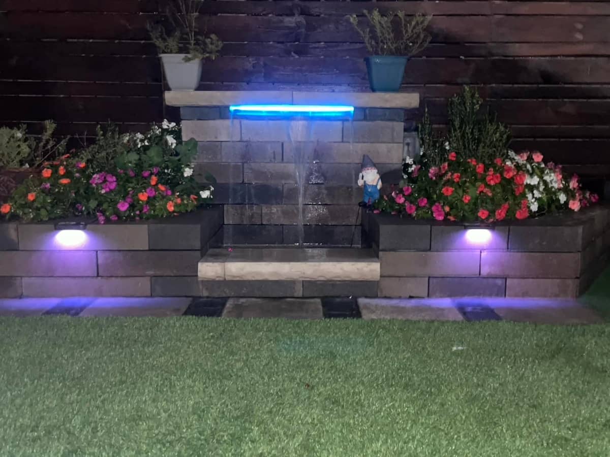 garden small water fountain with flowers