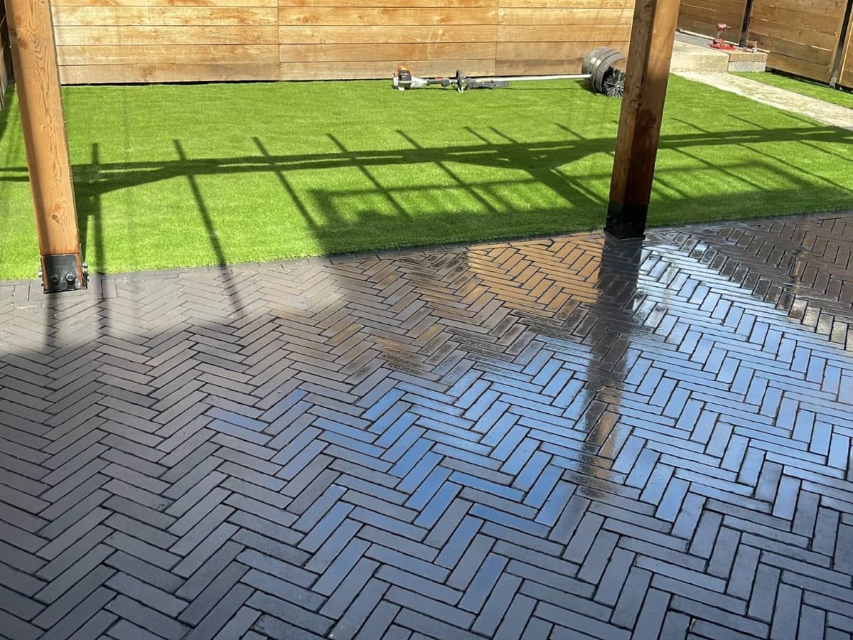 herringbone paver patio with artifical turf