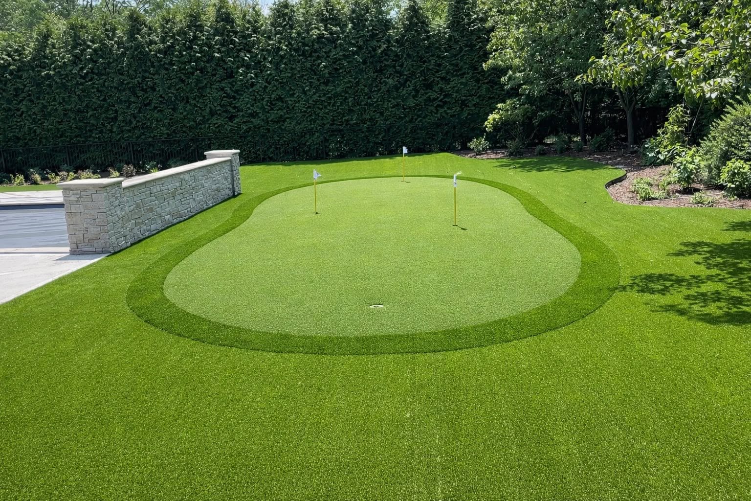 putting green with three holes