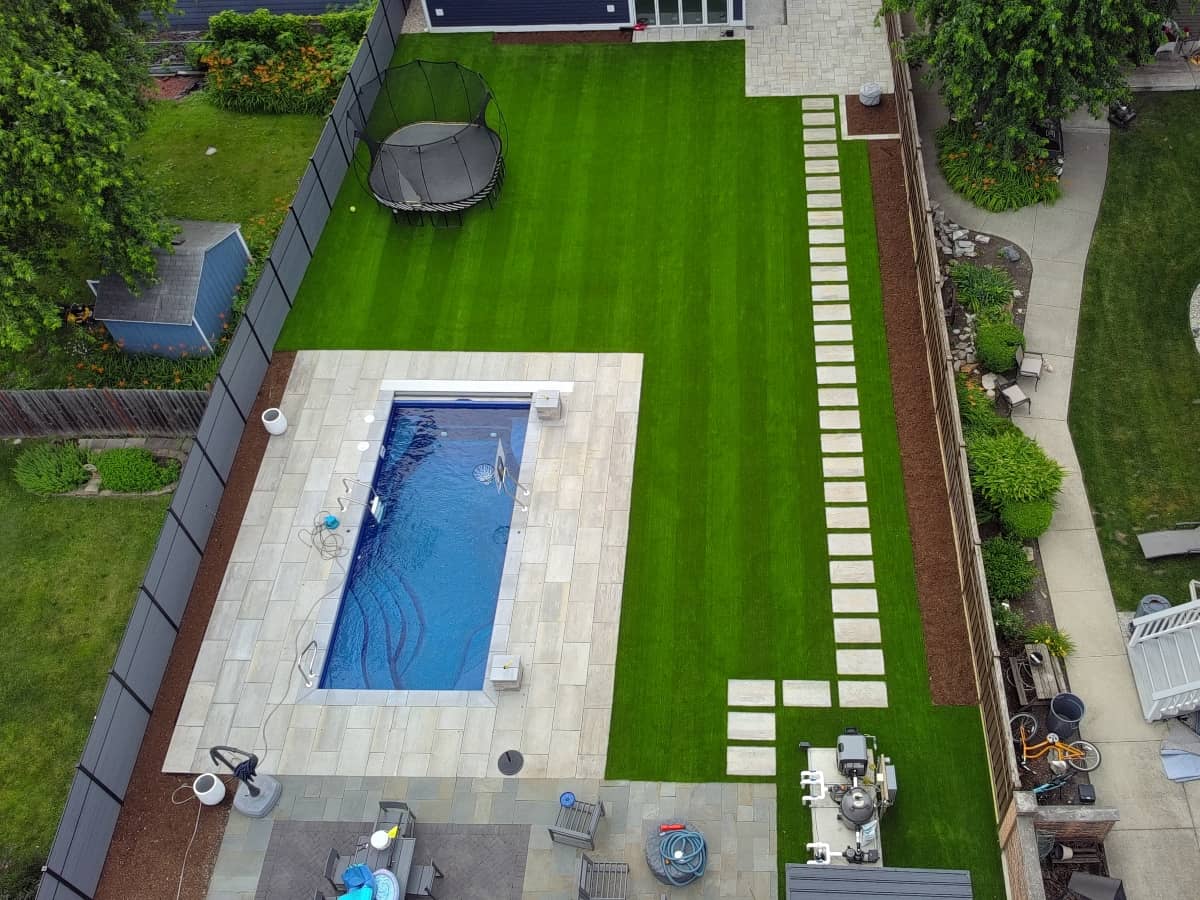 paver and artifical grass installation from a drone view photo